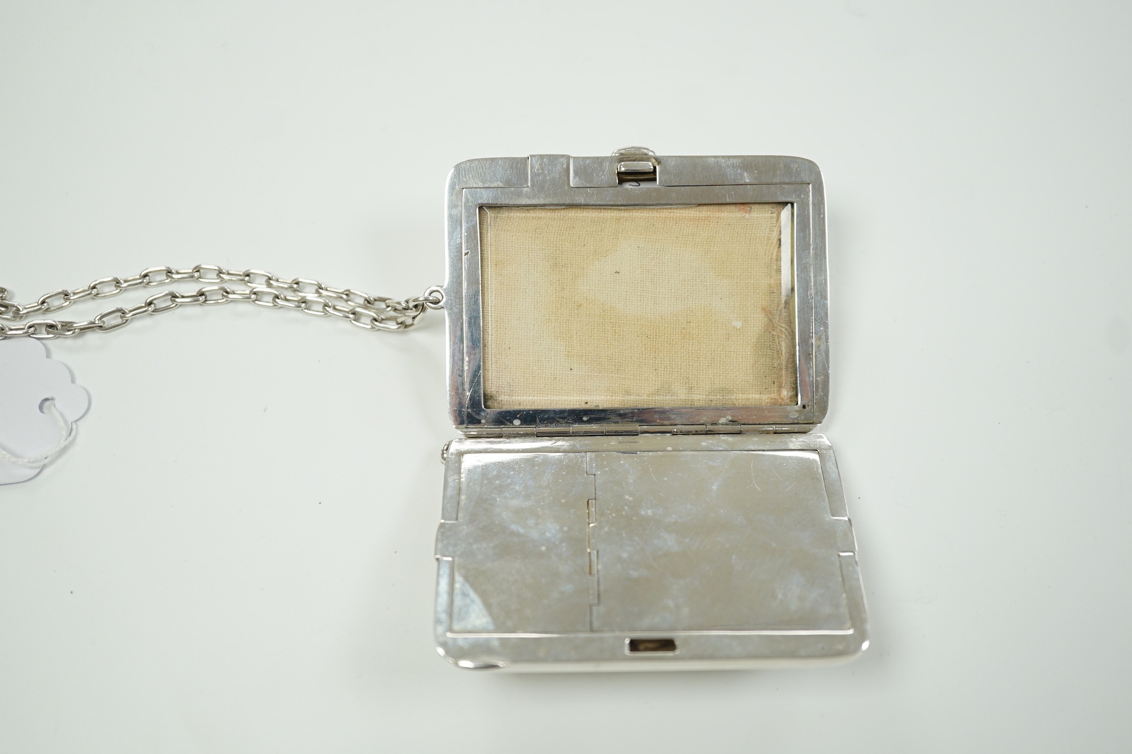 An early 20th century American engraved sterling rounded rectangular combination aide memoir, purse, pill box, sovereign and half sovereign case, by R. Blackinton & Co, with pencil and suspension chain, 88mm.